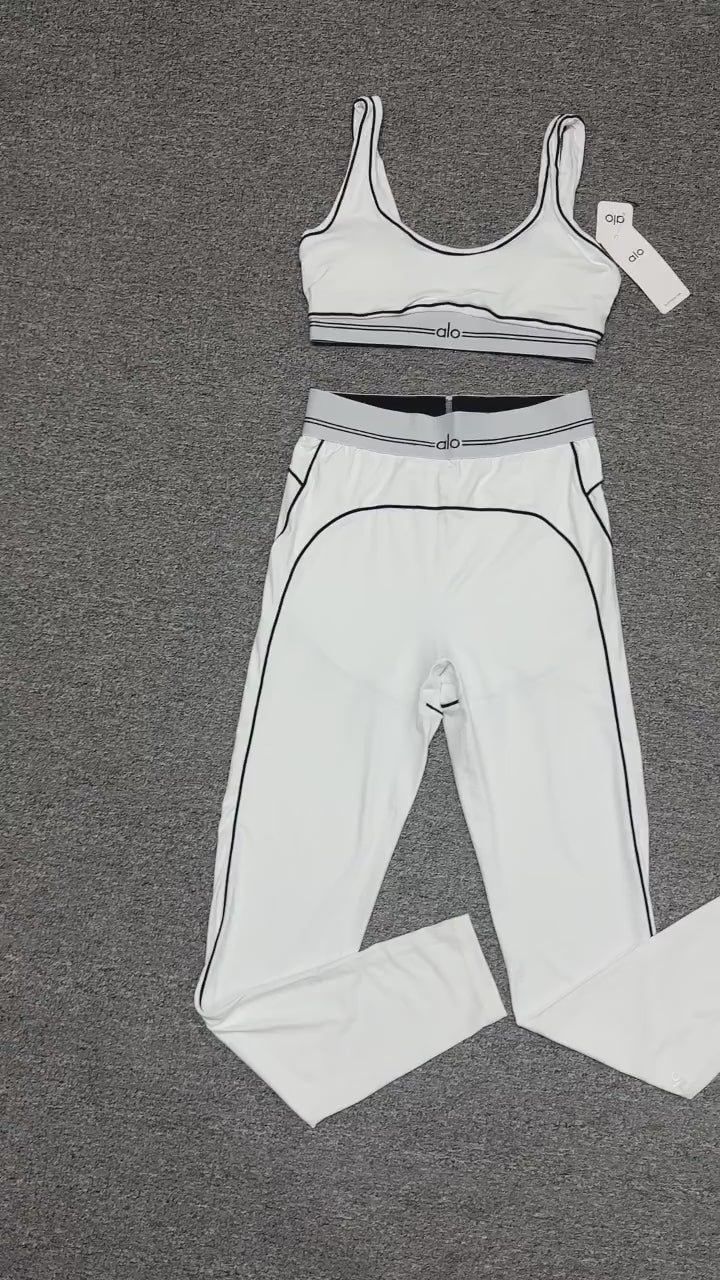 ALO Heart Throb Bra and High-Waist Legging Set in White Black front view
