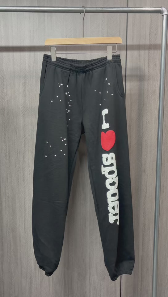 SP5DER Souvenir black sweatpants front view with white I Heart SP5DER graphic and red heart