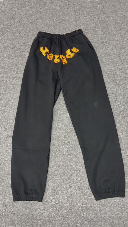 SP5DER Issue 404 black sweatpants front view with raised orange chenille logo