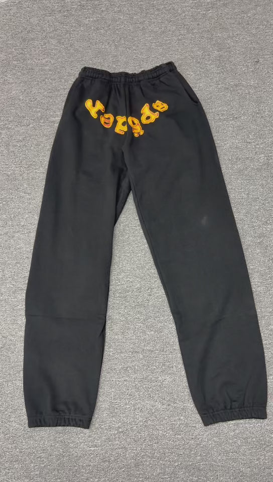 SP5DER Issue 404 black sweatpants front view with raised orange chenille logo