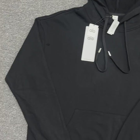 ALO Accolade Hoodie in Black front view with embroidered chest logo