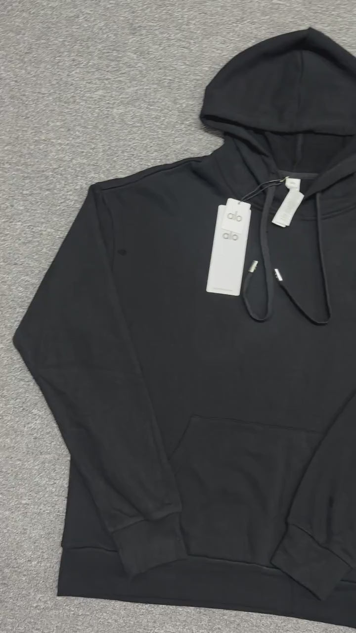 ALO Accolade Hoodie in Black front view with embroidered chest logo
