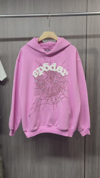 Sp5der OG Web Hoodie Pink front view with raised white logo, dark web graphic and multicolor stars