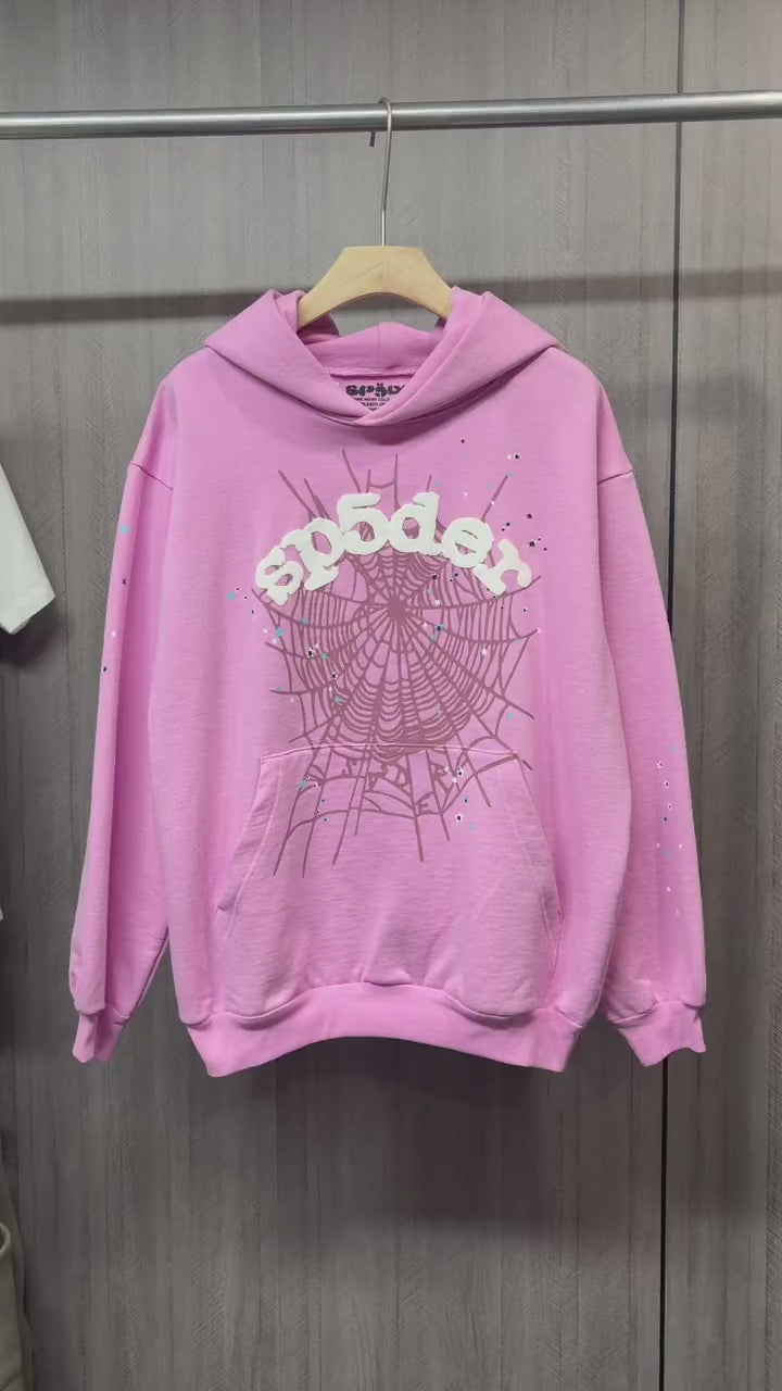 Sp5der OG Web Hoodie Pink front view with raised white logo, dark web graphic and multicolor stars