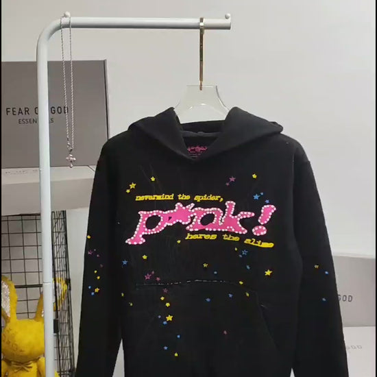 Sp5der P*NK Hoodie Black front view with raised pink lettering, spider web and multicolor stars