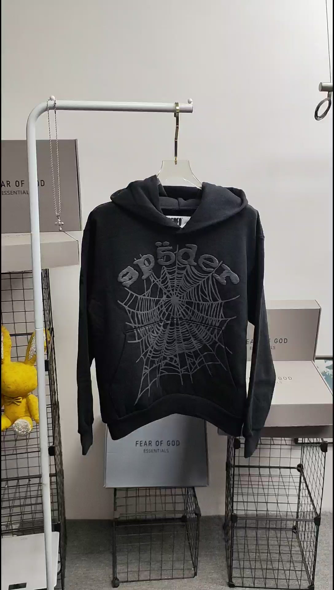 Sp5der OG Web Hoodie Black front view with raised dark-grey logo and tonal spider-web graphic