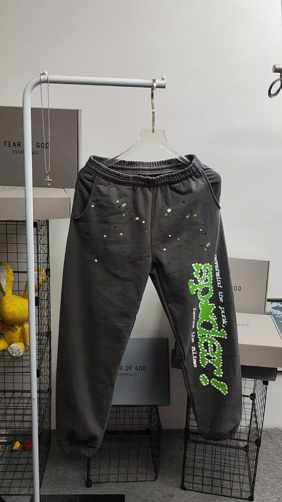 SP5DER Punk V2 slate grey sweatpants front view with green leg graphic and scattered stars