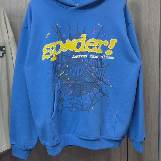 Sp5der TC Blue Here's the Slime Hoodie front view with yellow puff lettering and spider web graphic