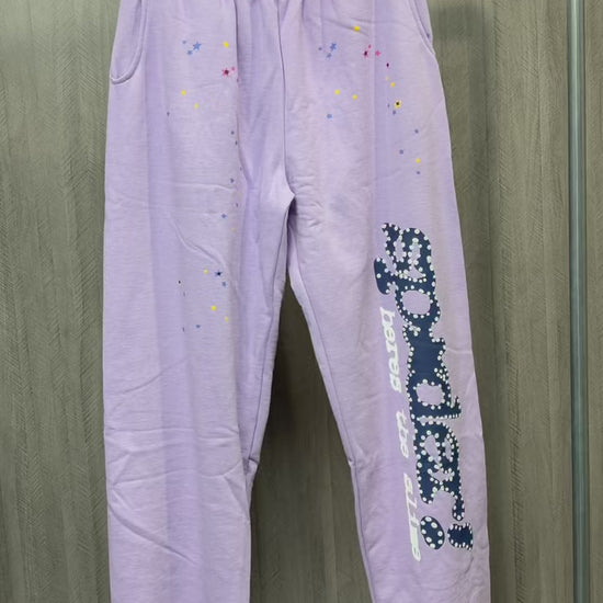 SP5DER Acai purple sweatpants front view with navy leg graphic and multicolor stars