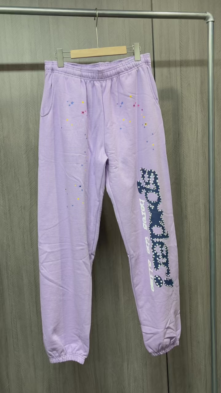 SP5DER Acai purple sweatpants front view with navy leg graphic and multicolor stars