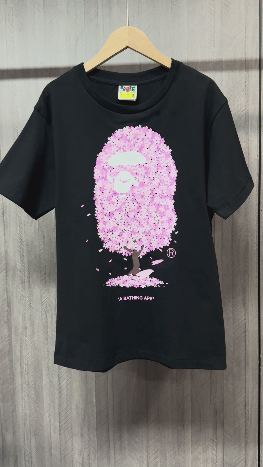 BAPE Pink cherry blossom graphic detail on black streetwear T-shirt