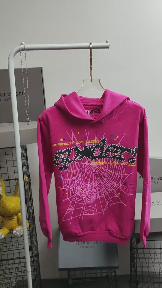 Sp5der P*NK V2 Hoodie Pink front view with black lettering, white spider web and colorful stars